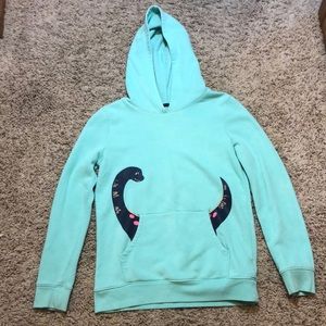 Teal hoodie with a friendly monster coming from the pocket size XL 14/16